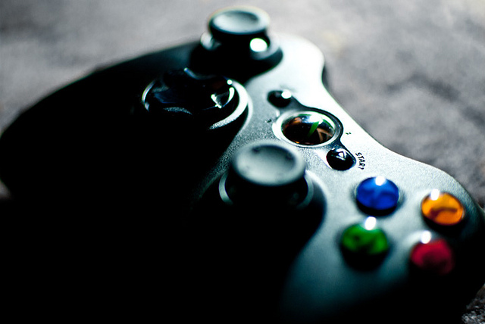Xbox 360 controller resting on a flat surface. Image credit: Steve Petrucelli, Flickr
